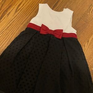 Red, black, and white dress with button back and dot texture skirt